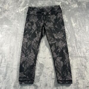 Black and grey capris with a sporty vibe
